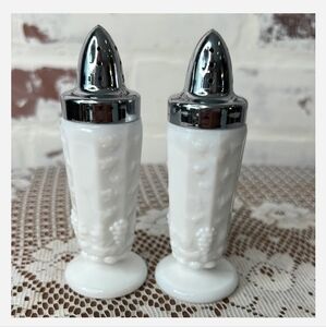 Vintage salt and pepper shakers in white